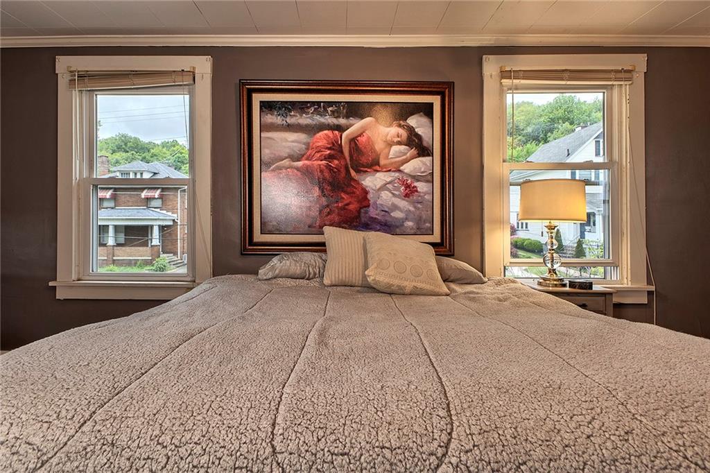 771 6th Street Beaver, PA 15009 - Photo 15 of 28 a bedroom with a bed and a painting on the wall
