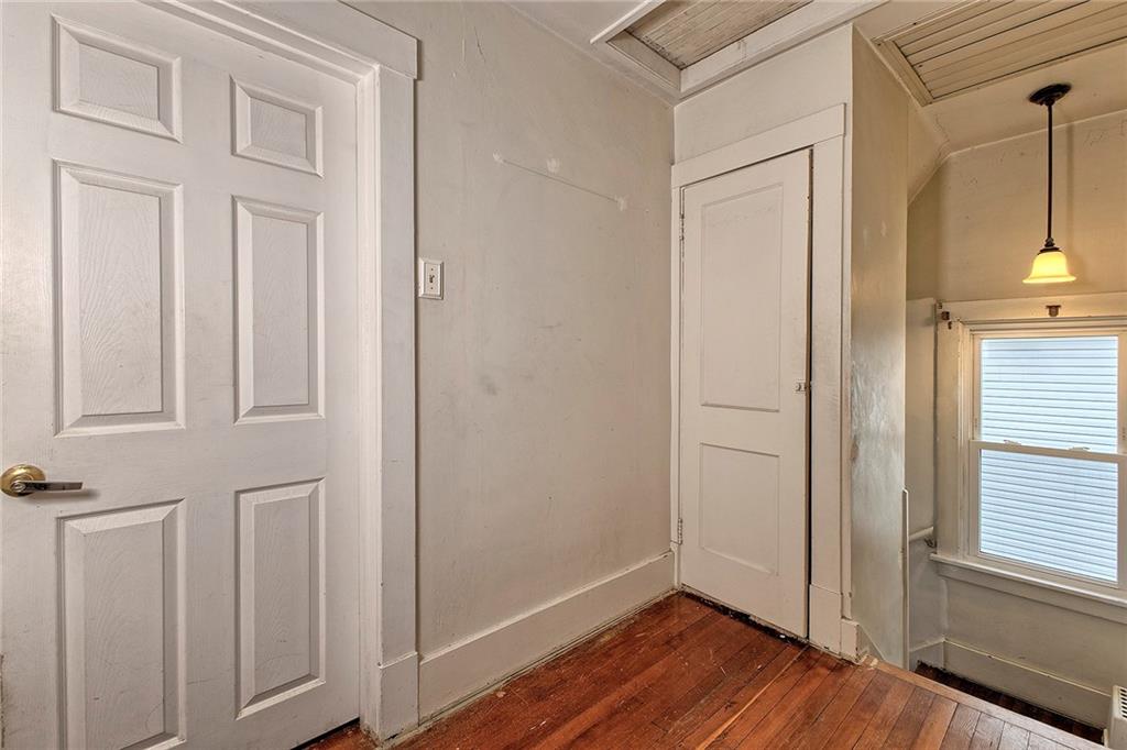 771 6th Street Beaver, PA 15009 - Photo 19 of 28 an empty room with wooden floor and windows