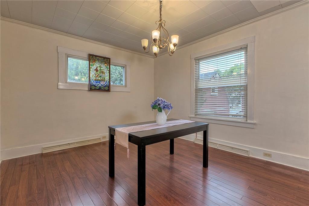 771 6th Street Beaver, PA 15009 - Photo 8 of 28 a view of a workspace with wooden floor and a window