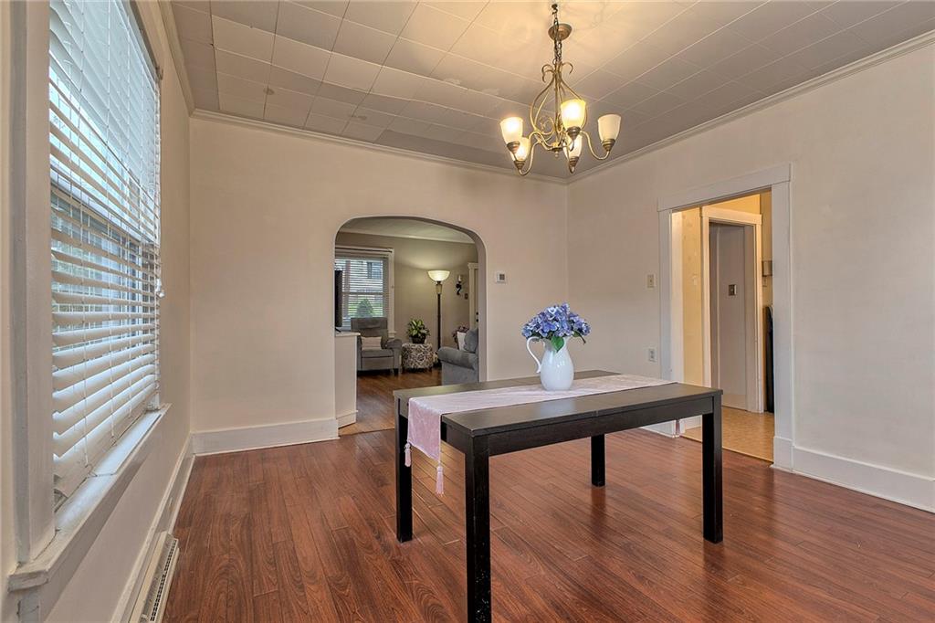771 6th Street Beaver, PA 15009 - Photo 9 of 28 a view of a dining room with furniture a chandelier and wooden floor