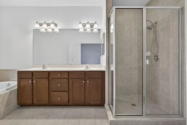 a bathroom with a sink vanity and a mirror