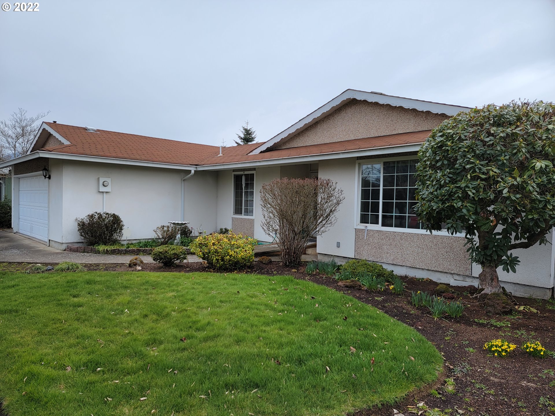 2287 8th Street Springfield, OR 97477 - Photo 1 of 18 a view of a house with backyard and garden