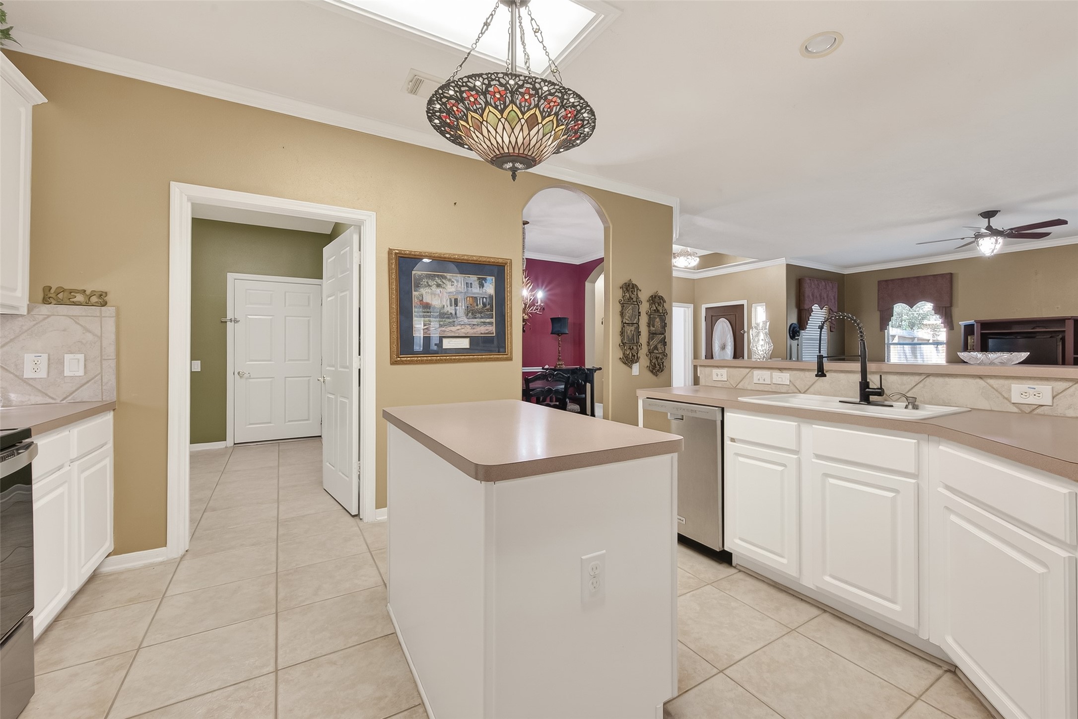 71 Ember Pines Court Conroe, TX 77384 - Photo 13 of 29 a kitchen with stainless steel appliances granite countertop a sink and dishwasher with white cabinets