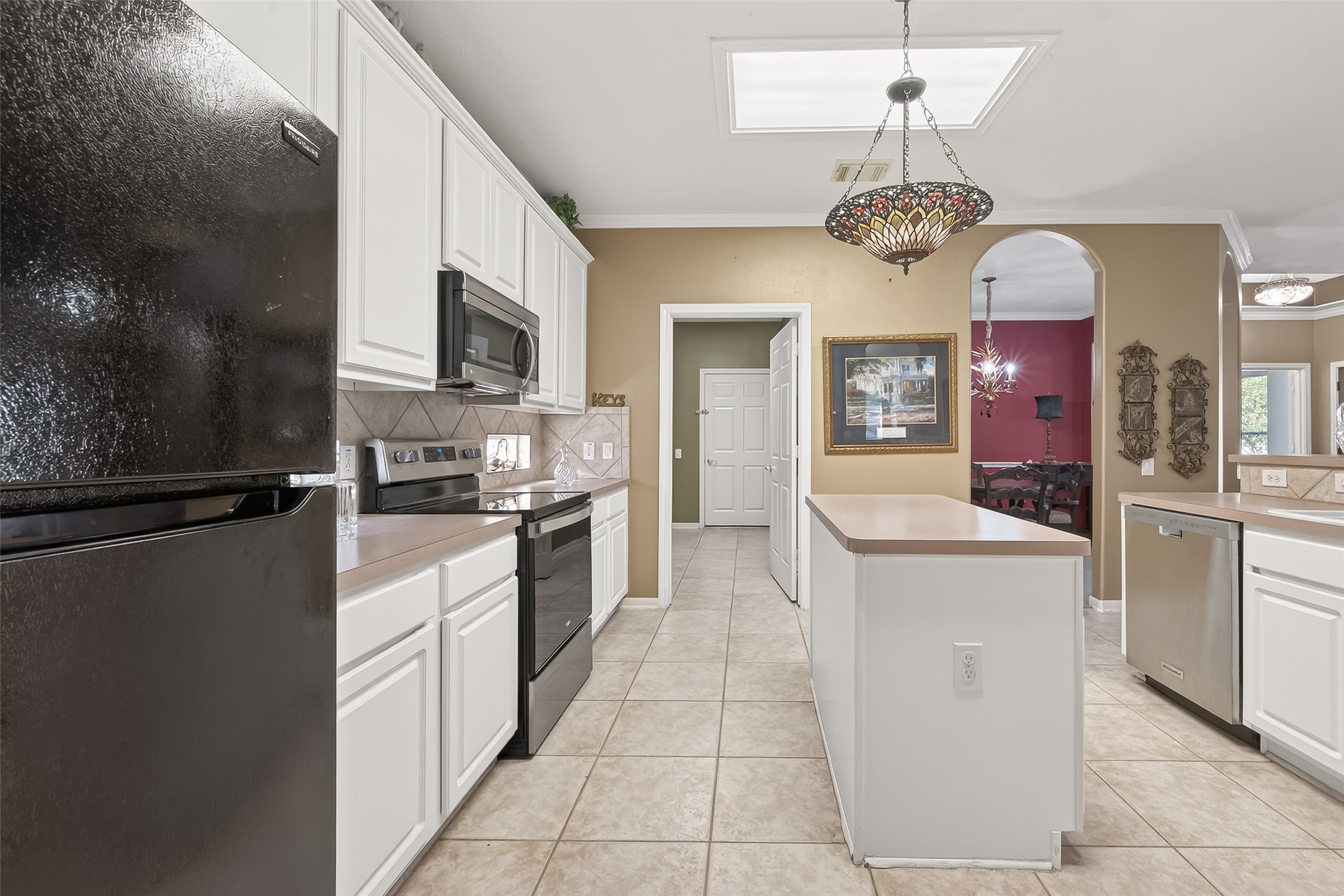 71 Ember Pines Court Conroe, TX 77384 - Photo 14 of 29 a kitchen with a counter space cabinets and stainless steel appliances