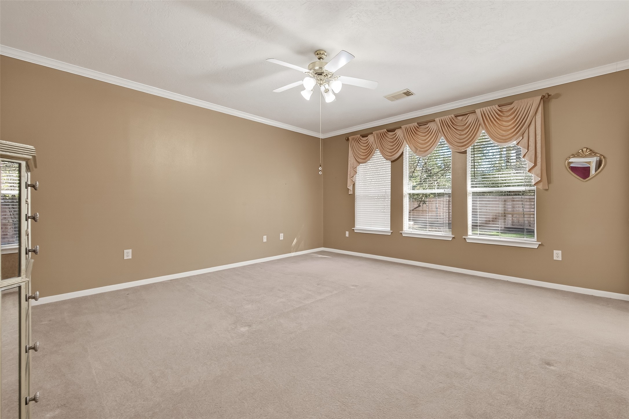 71 Ember Pines Court Conroe, TX 77384 - Photo 16 of 29 a view of an empty room with a window