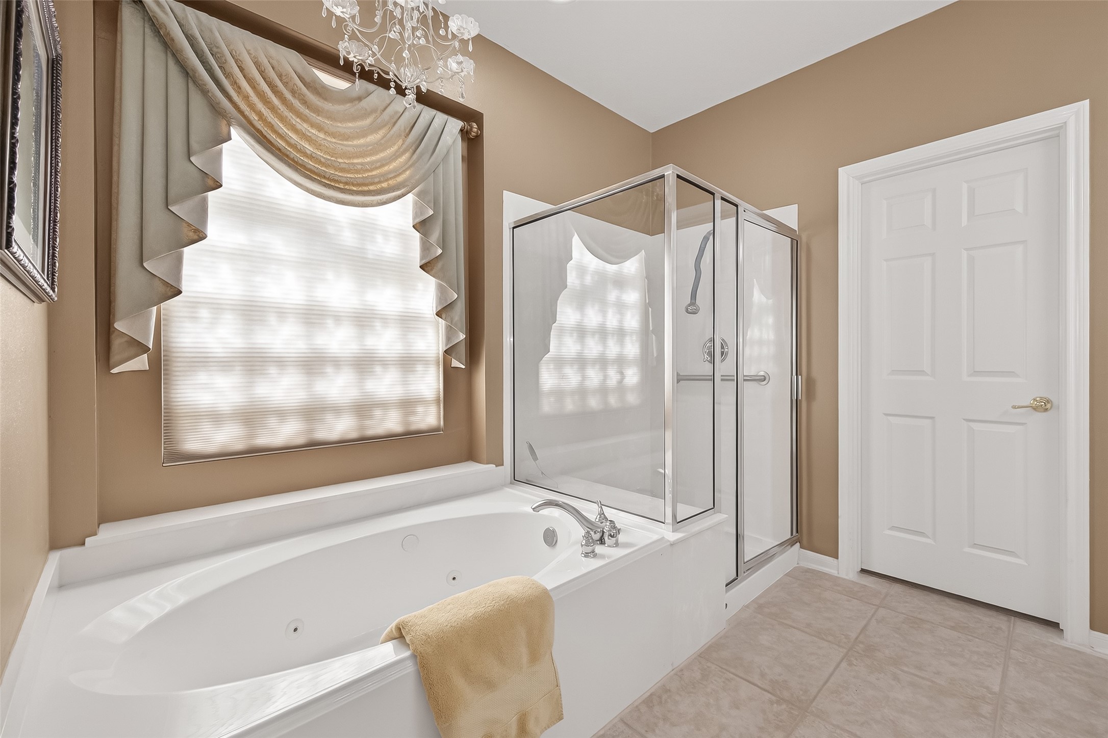 71 Ember Pines Court Conroe, TX 77384 - Photo 17 of 29 a bathroom with a bathtub and a shower