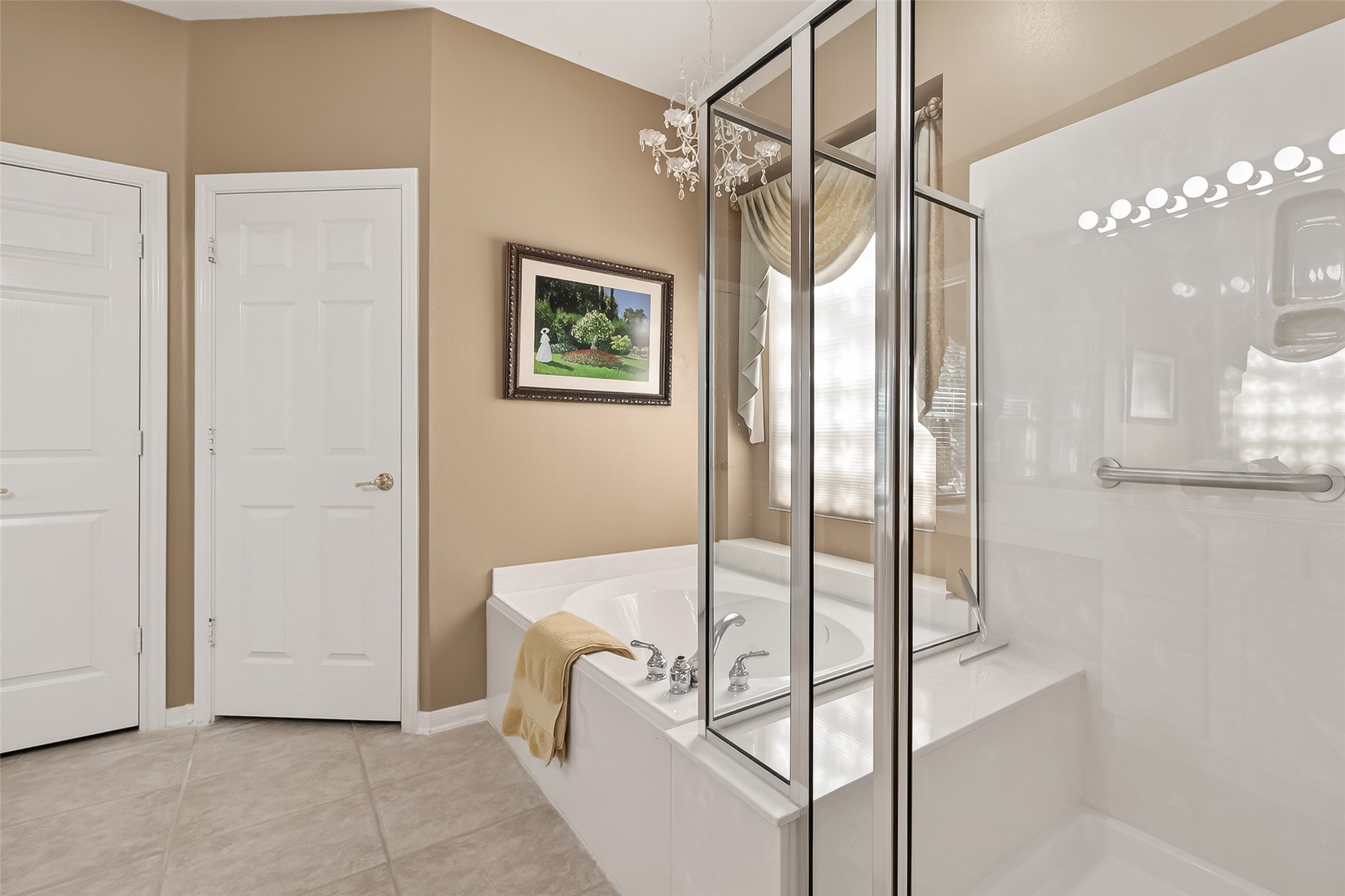 71 Ember Pines Court Conroe, TX 77384 - Photo 18 of 29 a bathroom with a tub and shower