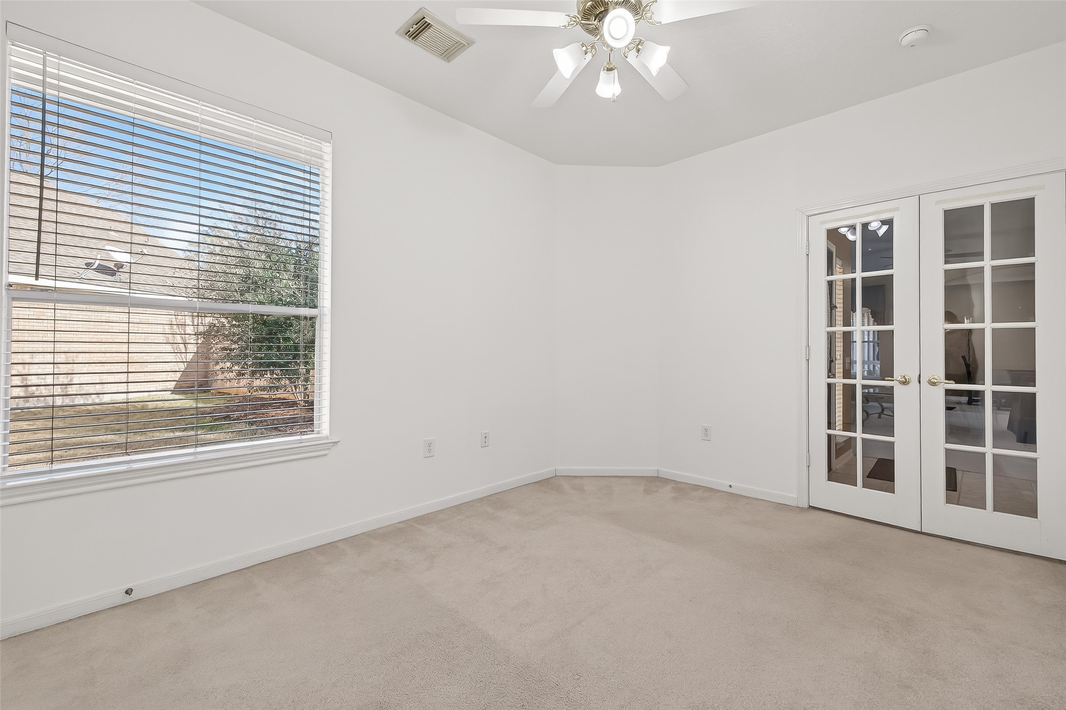 71 Ember Pines Court Conroe, TX 77384 - Photo 22 of 29 an empty room with a window