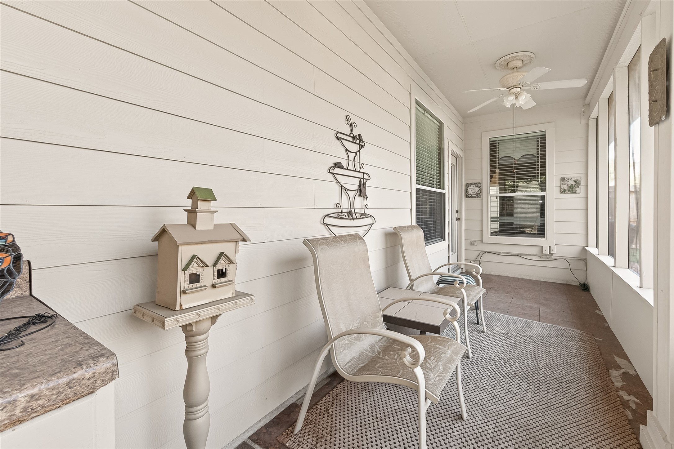 71 Ember Pines Court Conroe, TX 77384 - Photo 25 of 29 a living room with furniture and a wooden floor