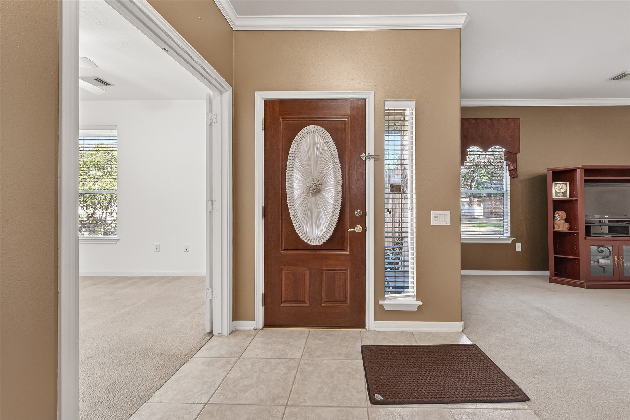 71 Ember Pines Court Conroe, TX 77384 - Photo 5 of 29 a view of a livingroom with furniture and an entryway