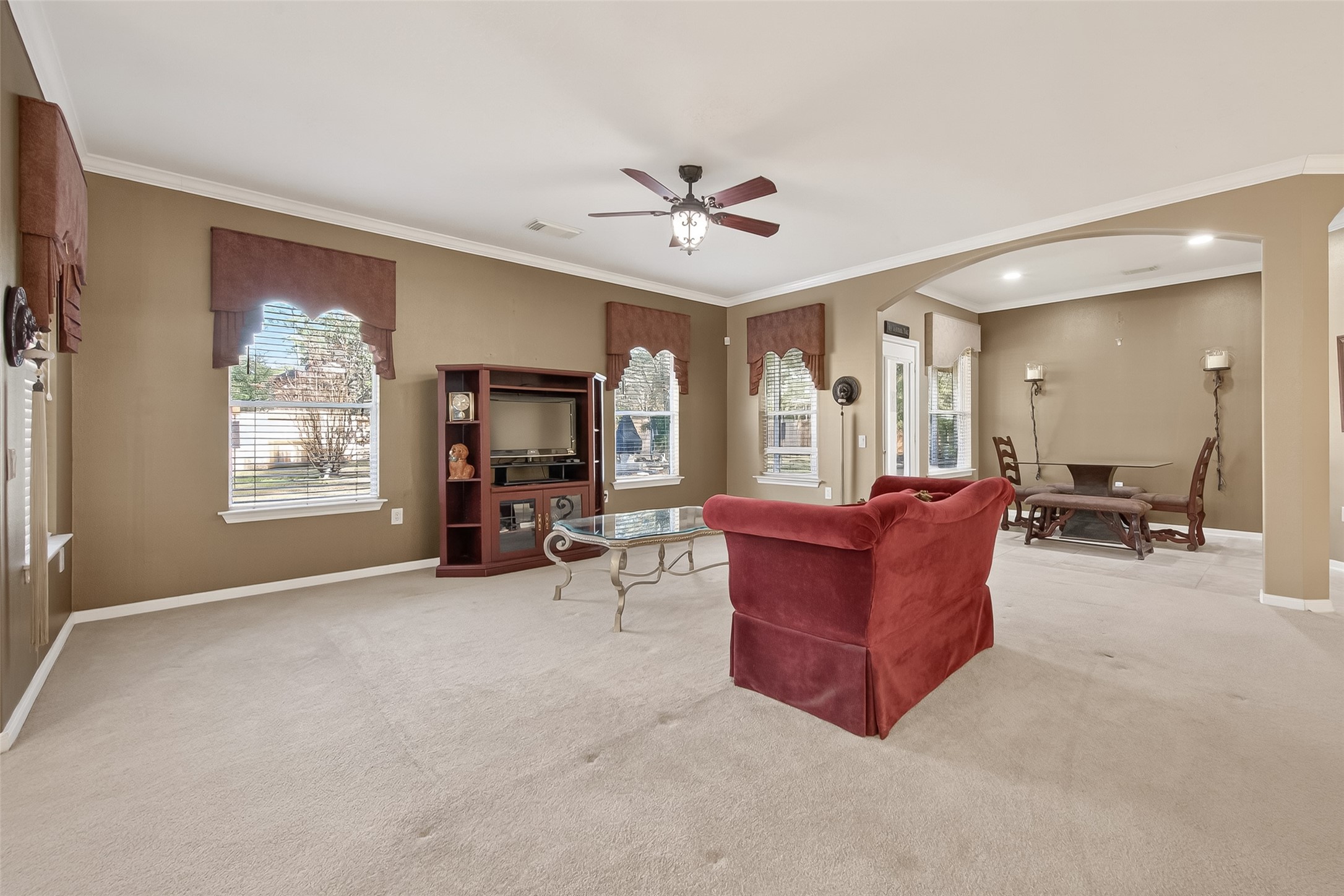 71 Ember Pines Court Conroe, TX 77384 - Photo 9 of 29 a living room with furniture and a large window