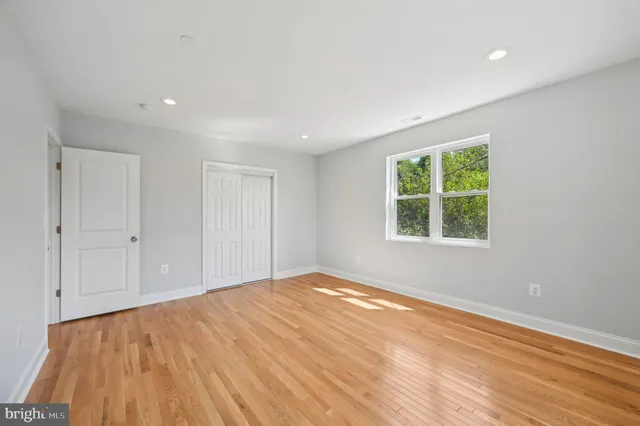 a view of hallway with wooden floor
