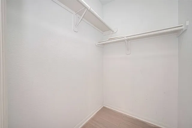 a view of an empty walk in closet