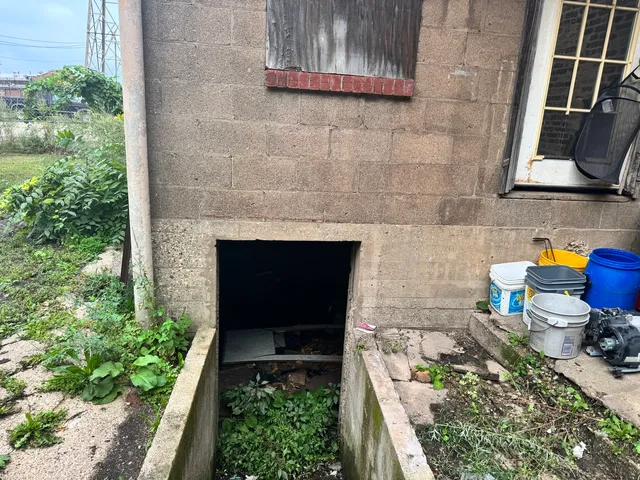 a backyard of a house with outdoor seating