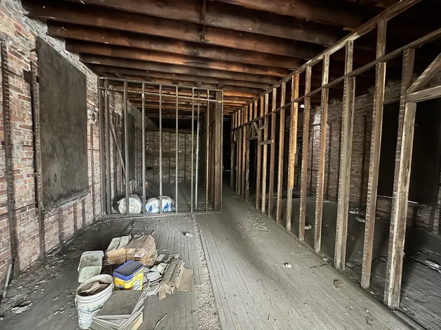 a view of a porch with furniture and floor to ceiling window