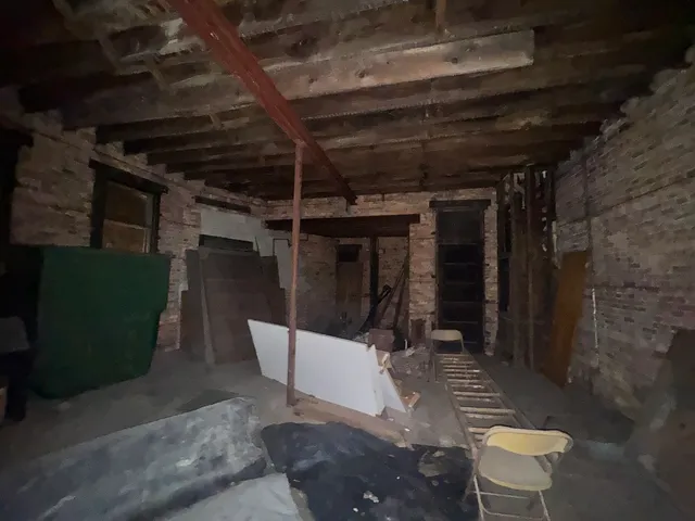 a bathroom with a shower and a mirror