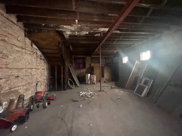 a kitchen with a refrigerator and a stove top oven