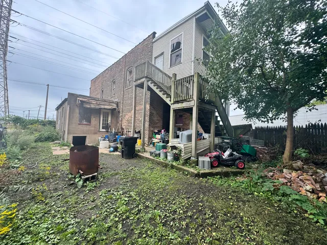 a front view of a house with sitting area