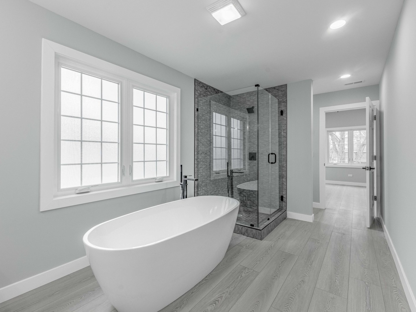 3548 Clinton Avenue Berwyn, IL 60402 - Photo 26 of 49 a white bath tub sitting in a spacious bathroom with a bathtub and a shower