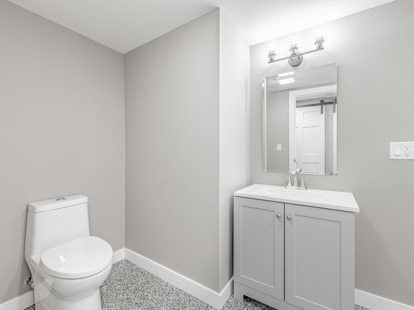 3548 Clinton Avenue Berwyn, IL 60402 - Photo 40 of 49 a bathroom with a toilet sink and mirror