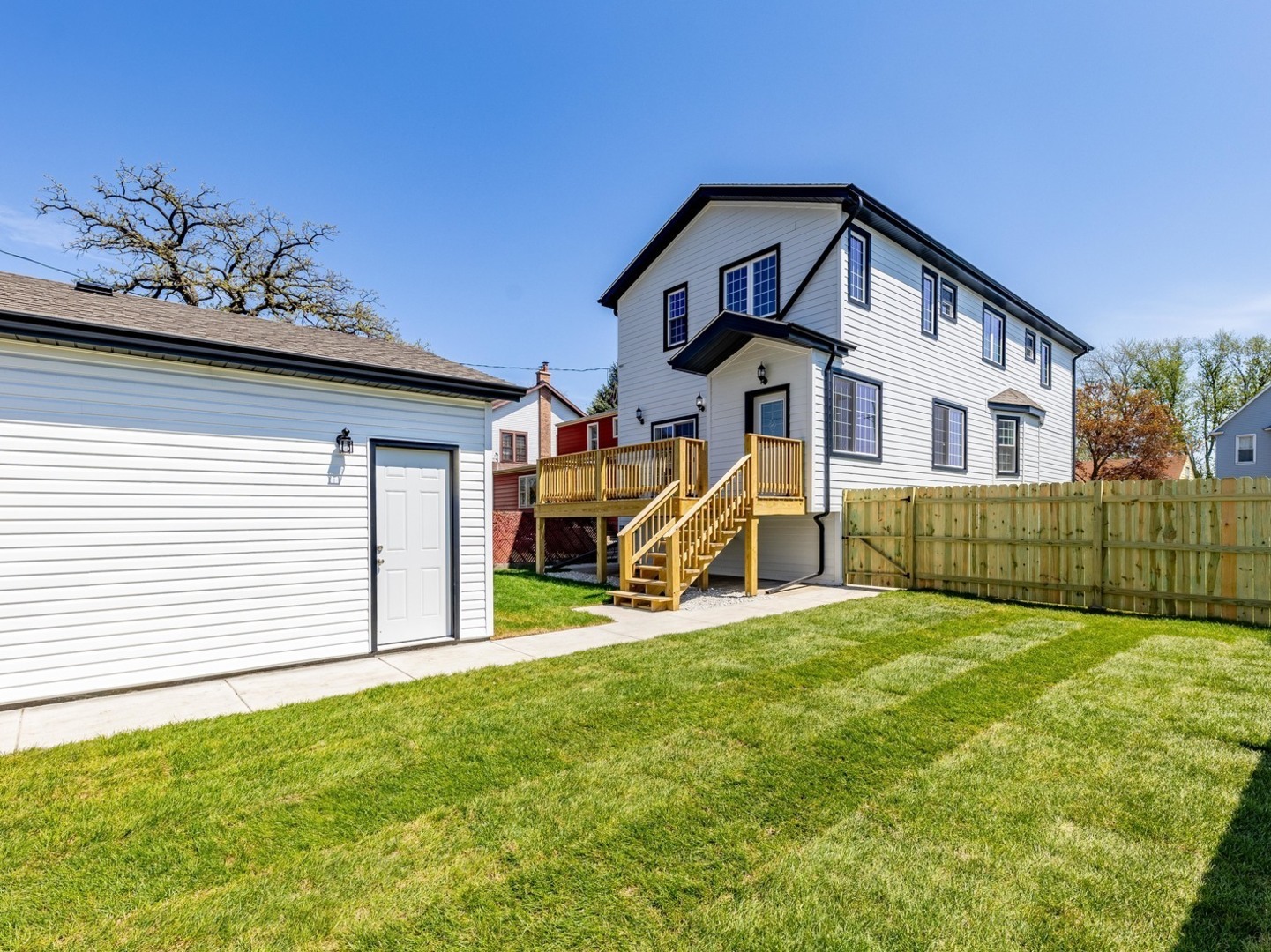 3548 Clinton Avenue Berwyn, IL 60402 - Photo 48 of 49 a front view of a house with a yard