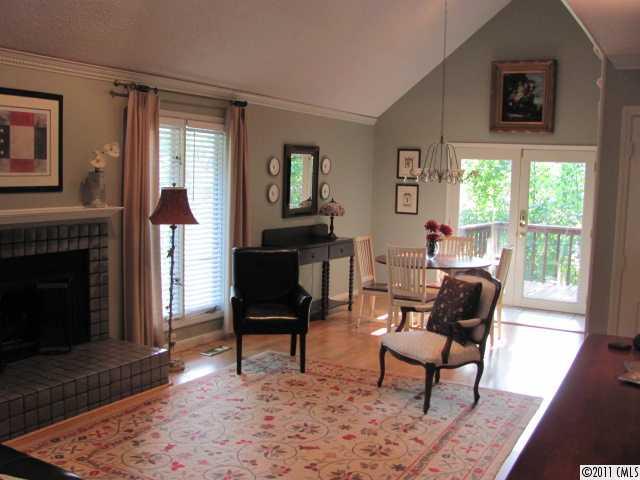 3800 Churchill Road, Unit 1 Charlotte, NC 28211 - Photo 2 of 16 a living room with furniture and a fireplace