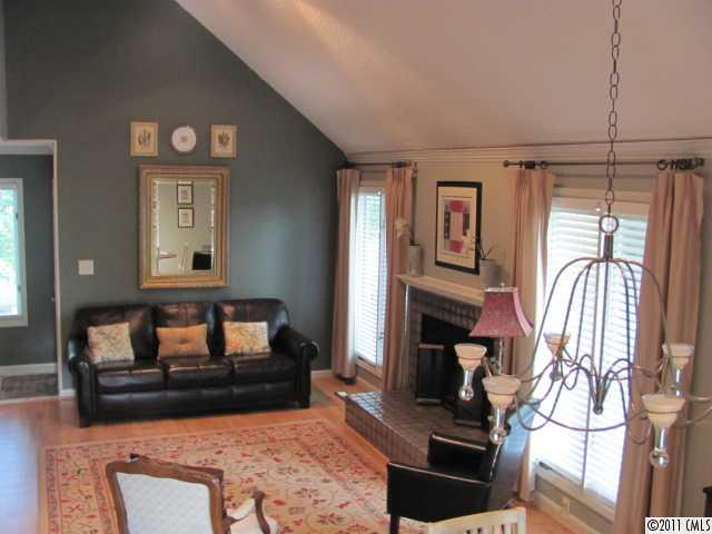 3800 Churchill Road, Unit 1 Charlotte, NC 28211 - Photo 3 of 16 a living room with furniture and a fireplace