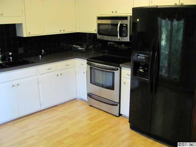 3800 Churchill Road, Unit 1 Charlotte, NC 28211 - Photo 5 of 16 a kitchen with a sink and a microwave