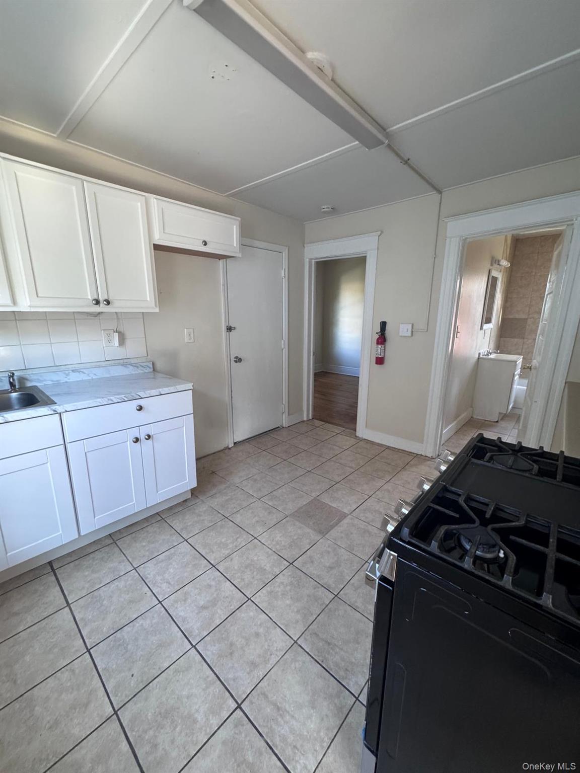 25 Lent Street, Unit 2 Poughkeepsie, NY 12601 - Photo 13 of 14 a kitchen with a sink and cabinets
