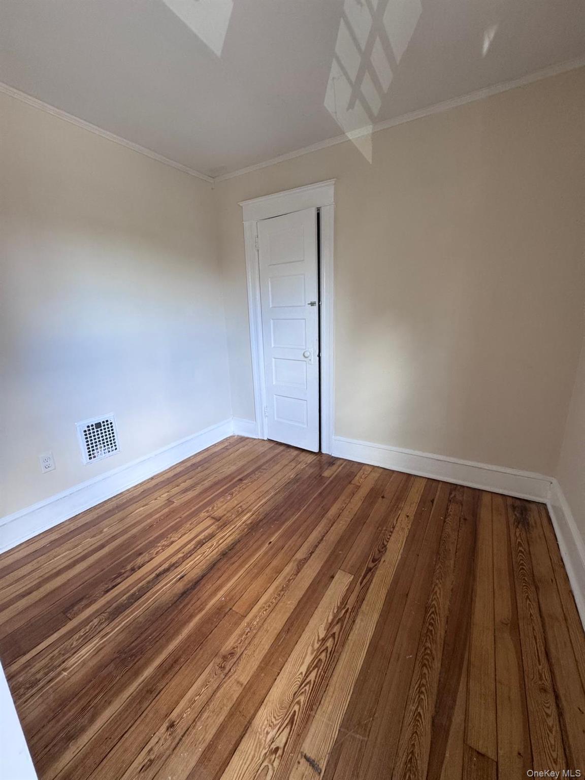 25 Lent Street, Unit 2 Poughkeepsie, NY 12601 - Photo 3 of 14 a view of a room with wooden floor and staircase