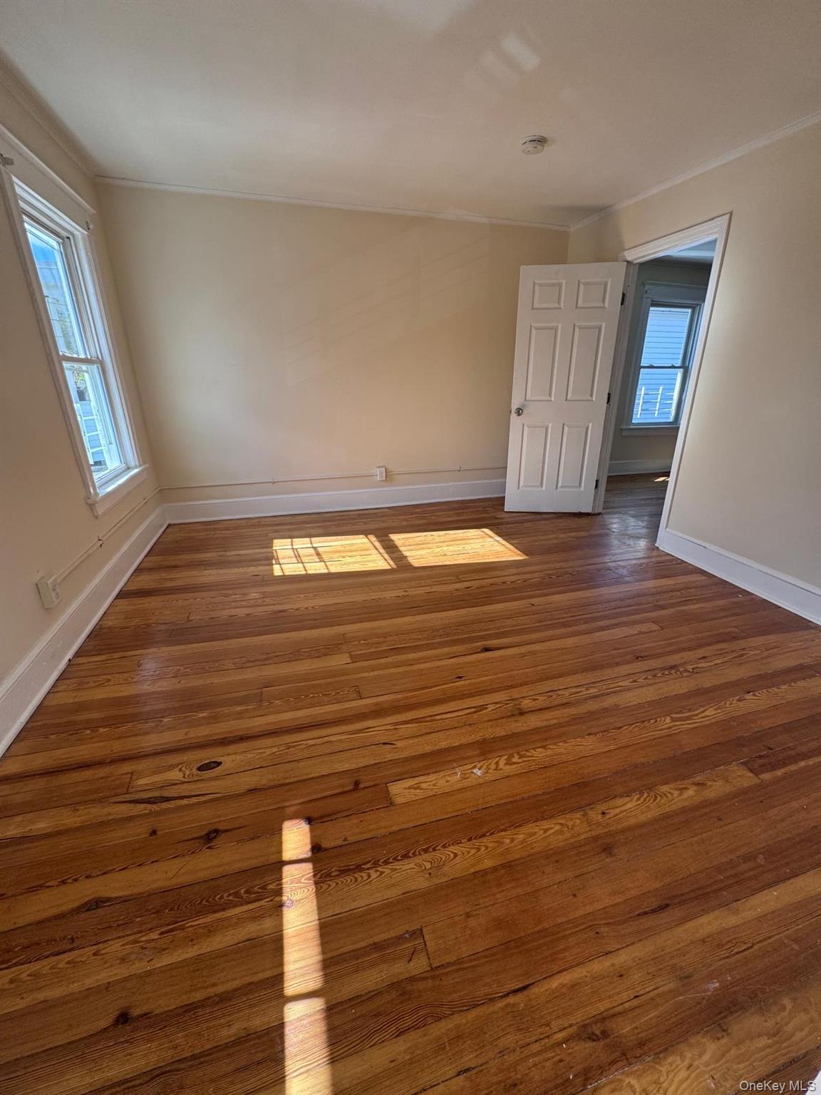25 Lent Street, Unit 2 Poughkeepsie, NY 12601 - Photo 6 of 14 a view of empty room with wooden floor
