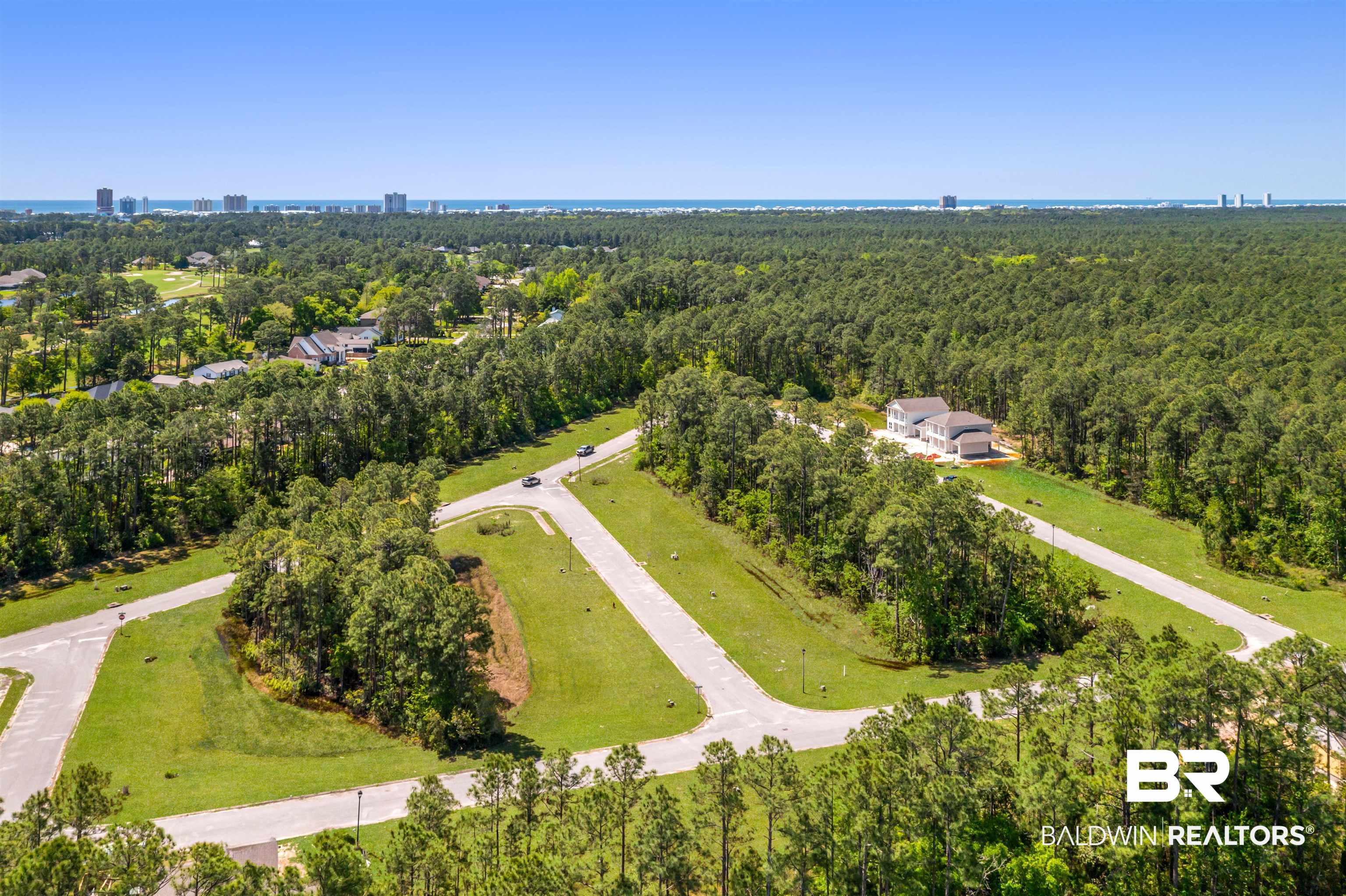 657 Island Way Gulf Shores, AL 36542 - Photo 39 of 59 Aerial view featuring a view of trees