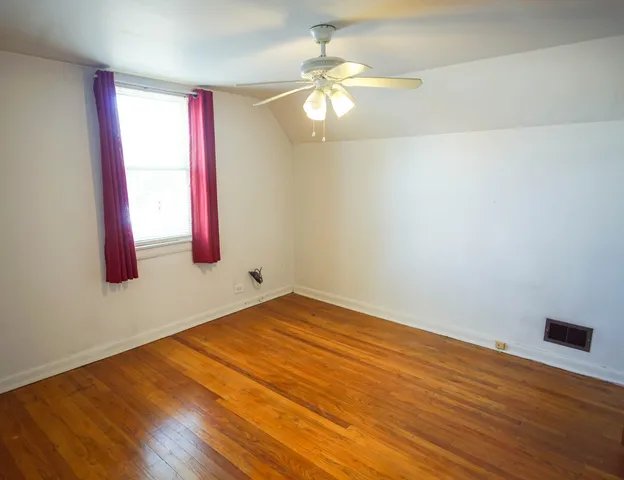a bathroom with a sink a toilet and window