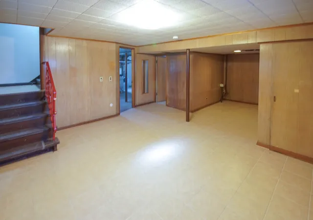 a view of a brick house with many windows