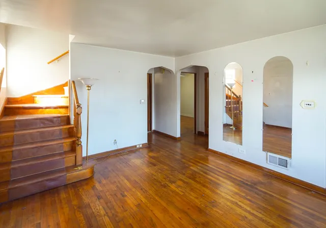 a kitchen with a sink a stove and cabinets