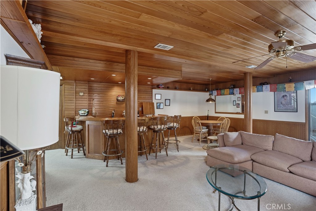30026 Big Range Road Canyon Lake, CA 92587 - Photo 16 of 48 a living room with lots of furniture and a chandelier