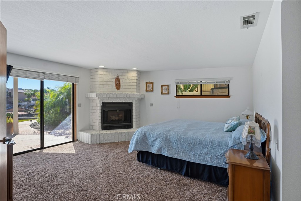 30026 Big Range Road Canyon Lake, CA 92587 - Photo 21 of 48 a living room with furniture and a fireplace