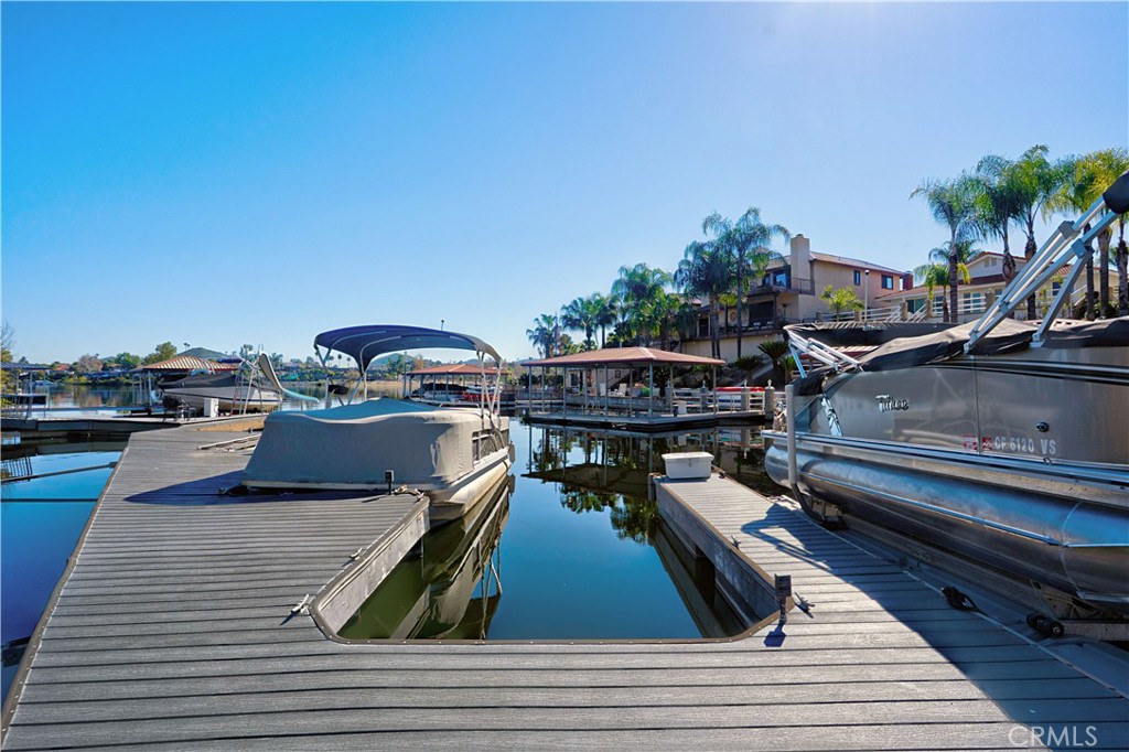 30026 Big Range Road Canyon Lake, CA 92587 - Photo 29 of 48 a view of a balcony with wooden floor and outdoor seating