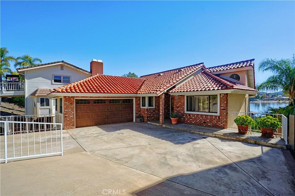30026 Big Range Road Canyon Lake, CA 92587 - Photo 31 of 48 a front view of a house with a yard and garage