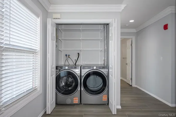 a view of entryway with washer and dryer
