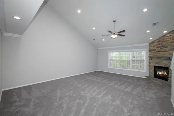 wooden floor in an empty room with a fireplace