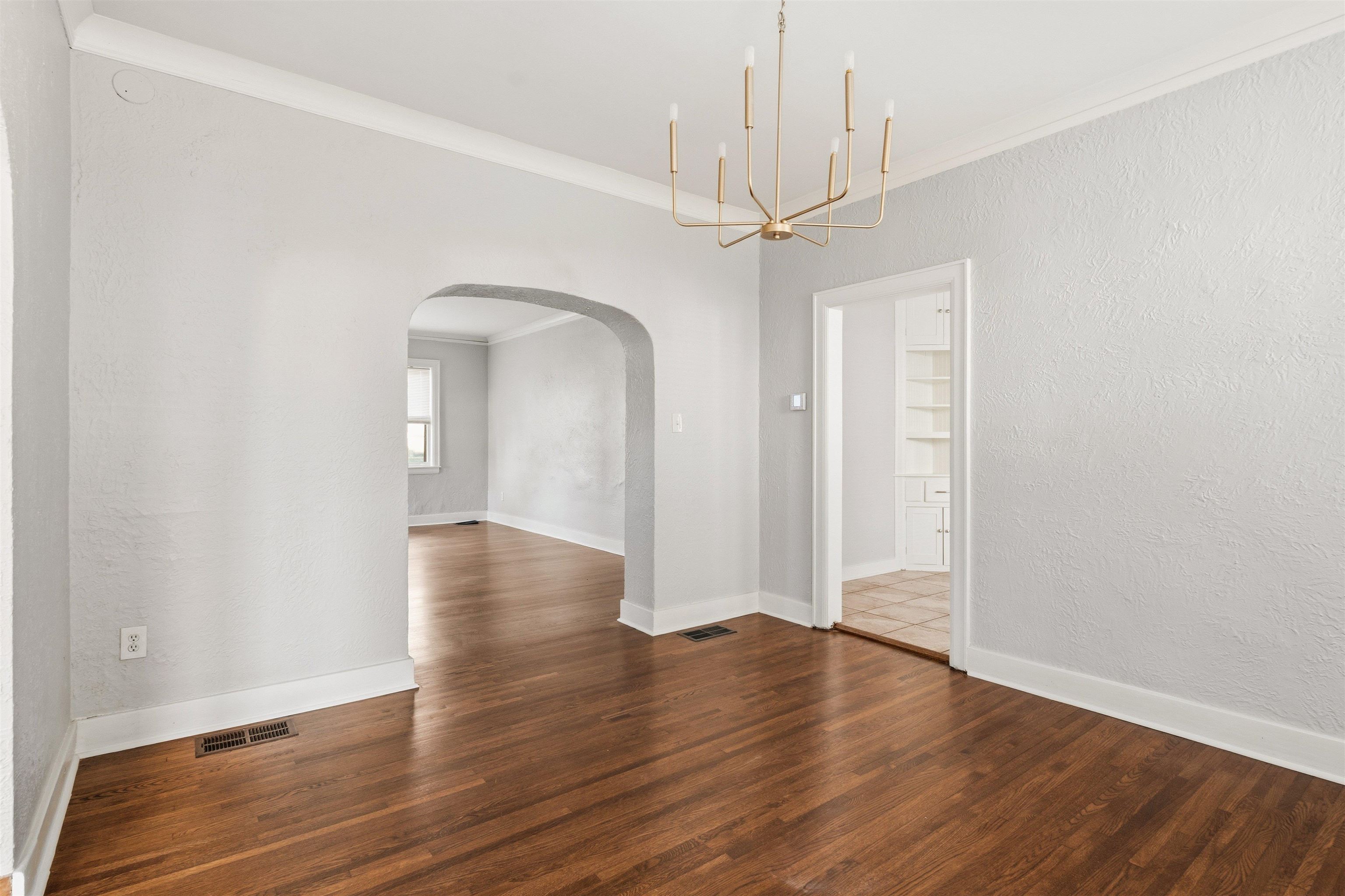871 University Street Memphis, TN 38107 - Photo 8 of 26 wooden floor in an empty room with a window