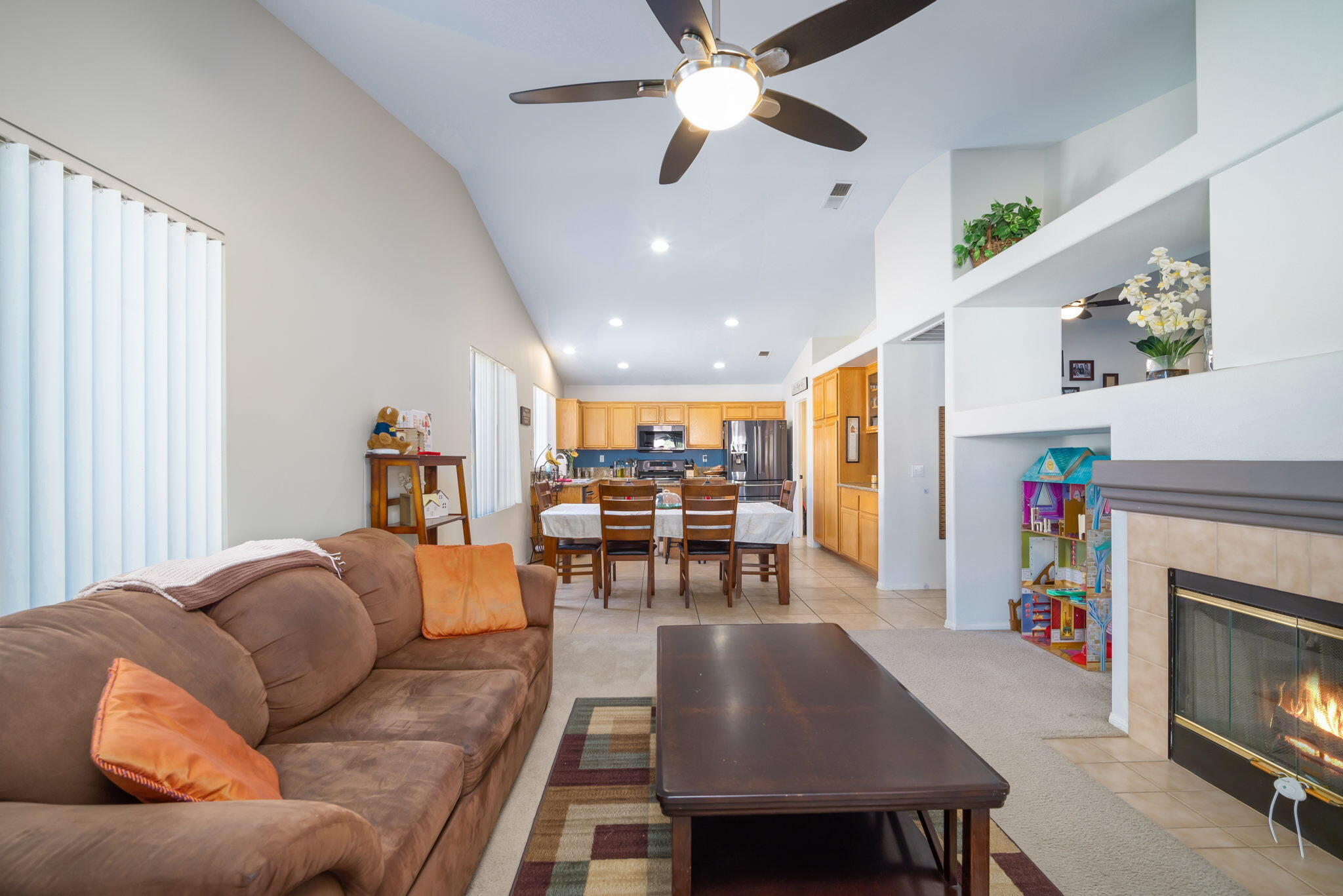79350 Paseo Del Rey La Quinta, CA 92253 - Photo 11 of 41 a living room with furniture a fireplace and a flat screen tv