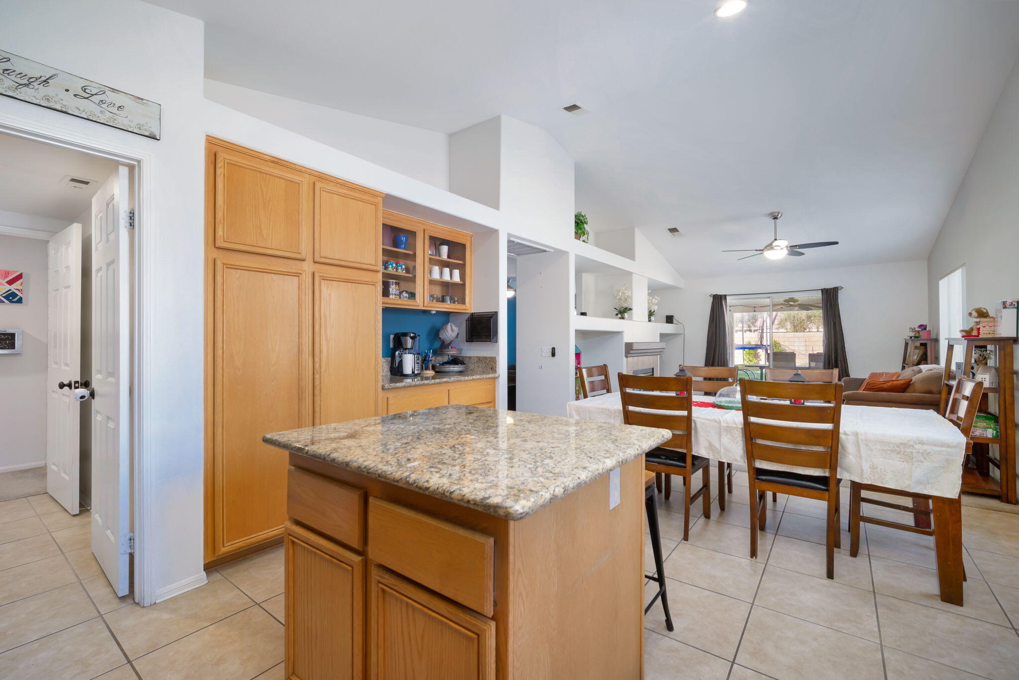 79350 Paseo Del Rey La Quinta, CA 92253 - Photo 19 of 41 a view of kitchen center island and living room