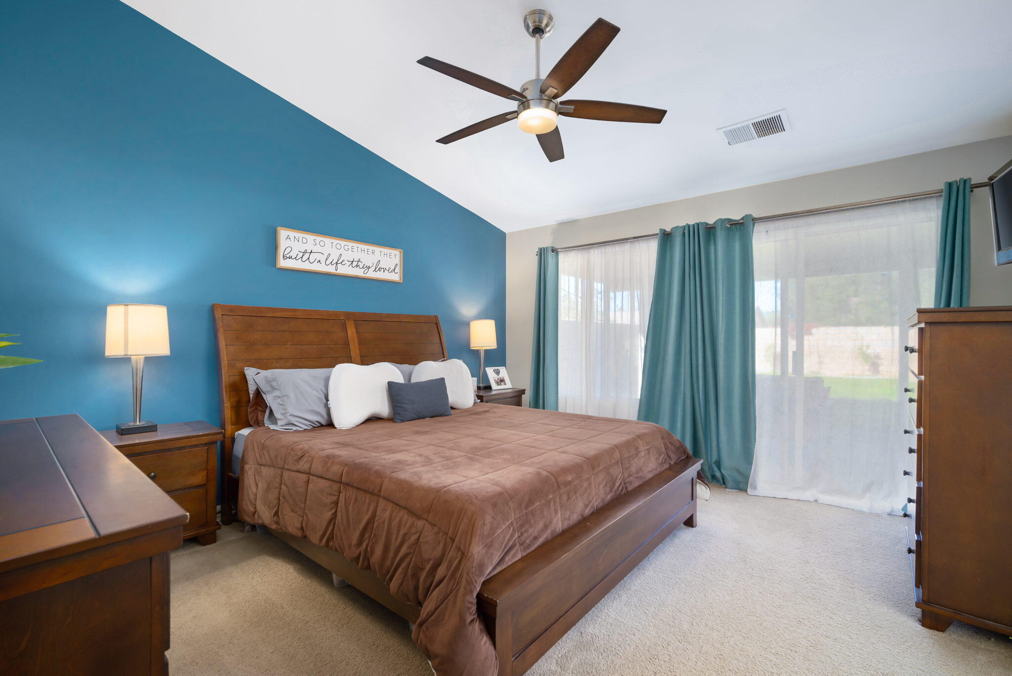 79350 Paseo Del Rey La Quinta, CA 92253 - Photo 22 of 41 a bedroom with a bed and a chandelier