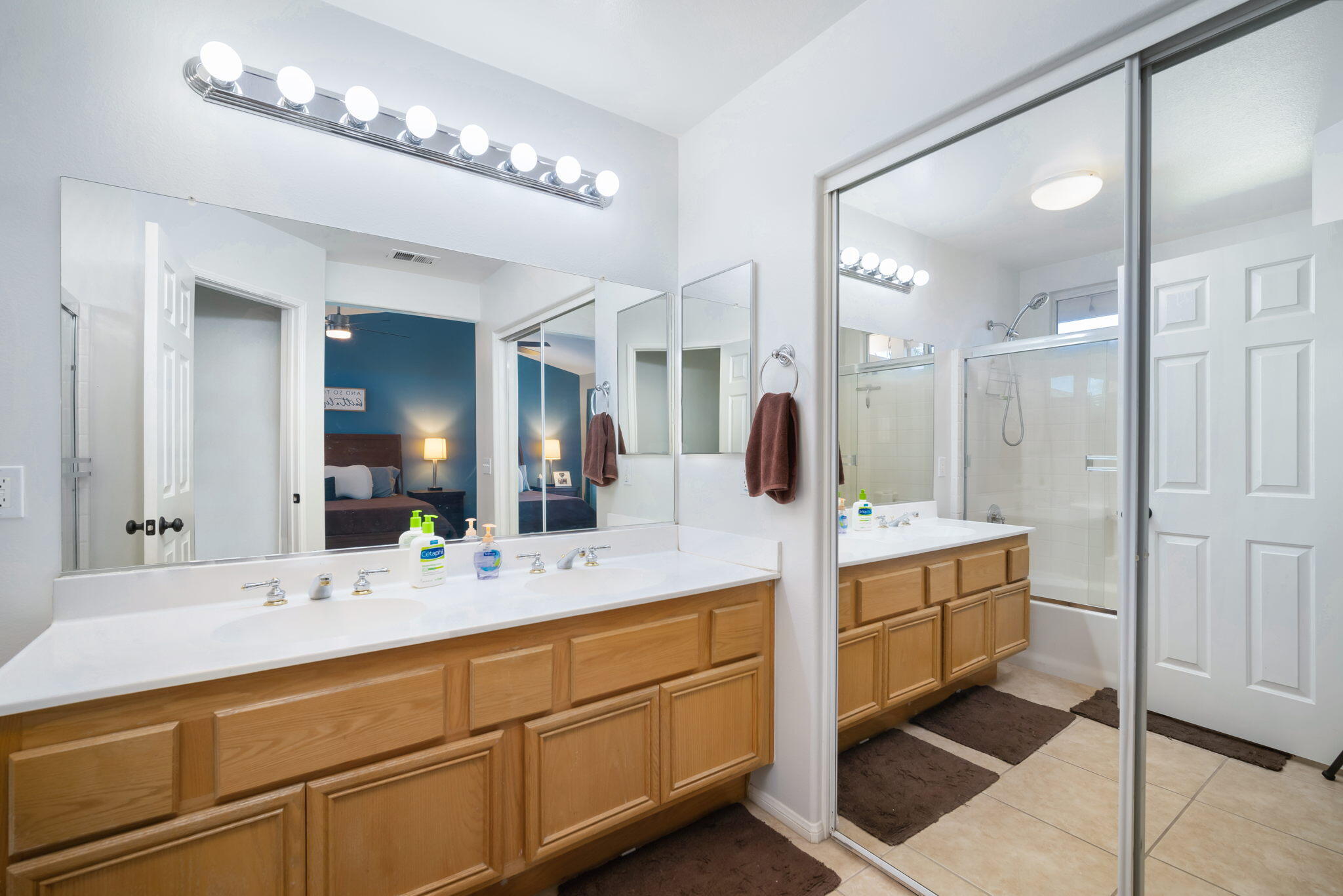 79350 Paseo Del Rey La Quinta, CA 92253 - Photo 26 of 41 a bathroom with a double vanity sink and a mirror