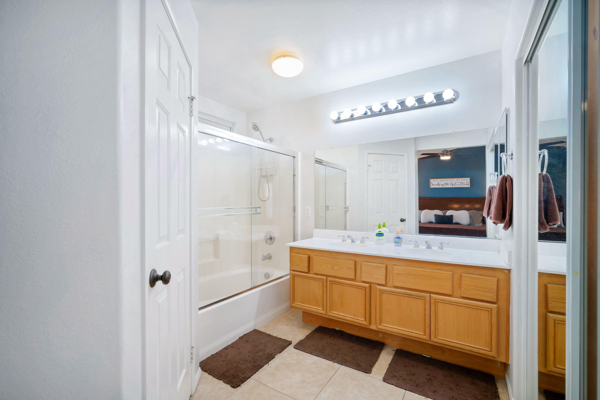 79350 Paseo Del Rey La Quinta, CA 92253 - Photo 27 of 41 a bathroom with a double vanity sink a mirror and shower