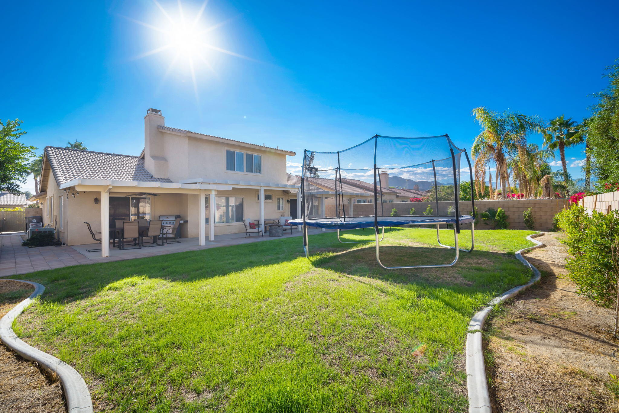 79350 Paseo Del Rey La Quinta, CA 92253 - Photo 31 of 41 a view of a house with swimming pool and a yard