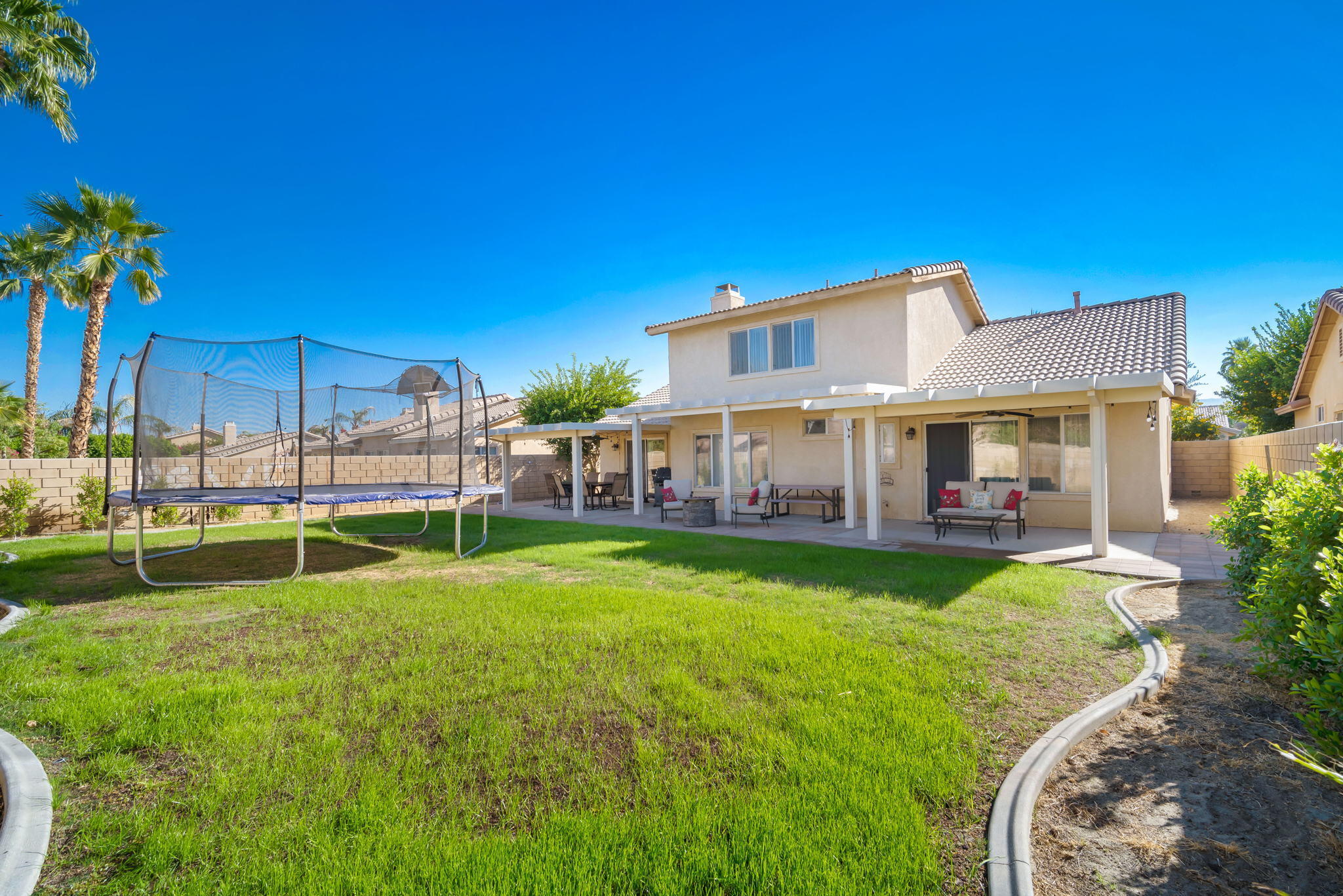 79350 Paseo Del Rey La Quinta, CA 92253 - Photo 32 of 41 a view of a house with a yard porch and sitting area