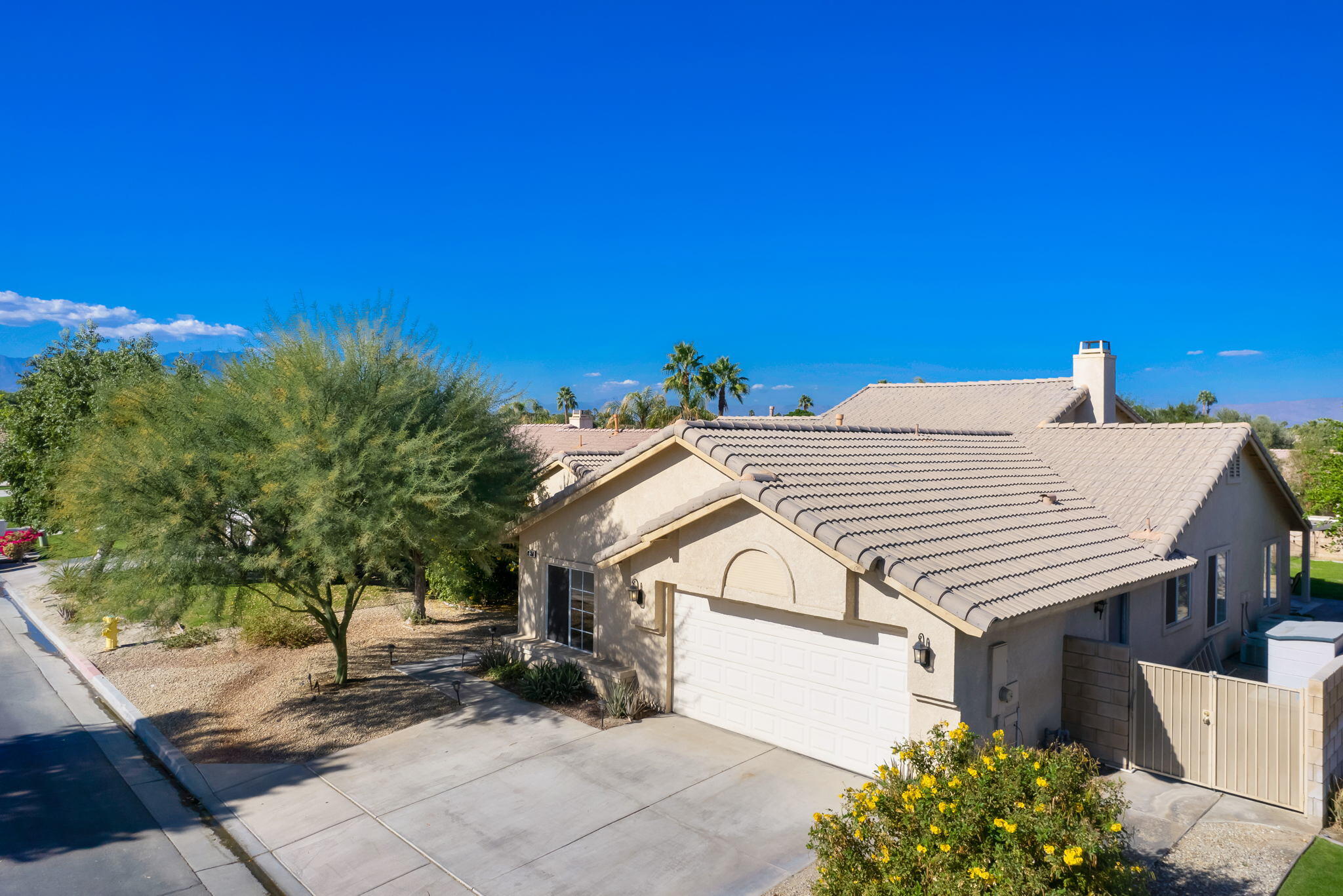 79350 Paseo Del Rey La Quinta, CA 92253 - Photo 41 of 41 a view of a house with a backyard and a tree